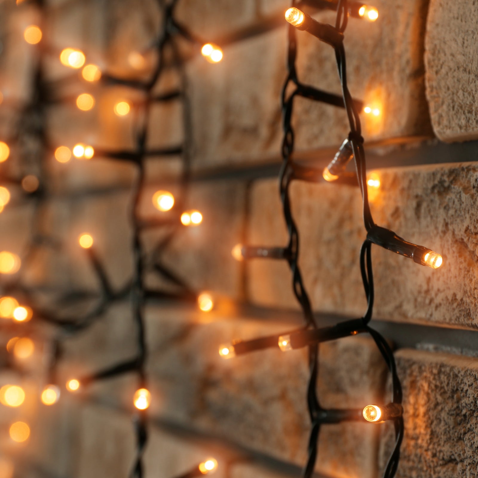 Fairy lights on a brick wall using the Brick Grips' Brick Hook.