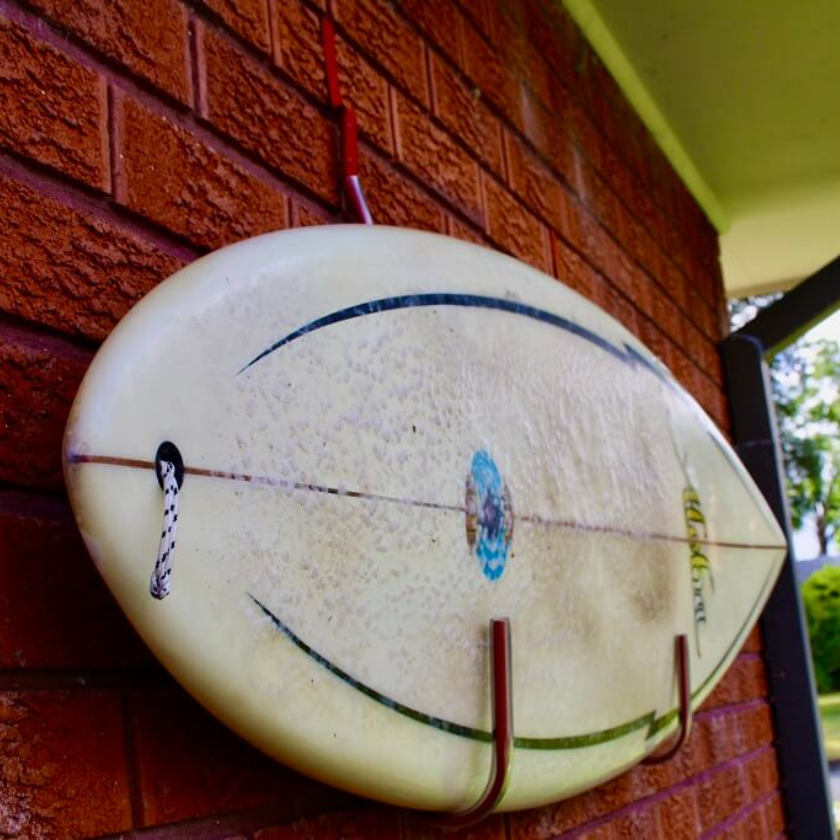 Sports equipment hung on a brick hanger can give your house a high-end appeal.