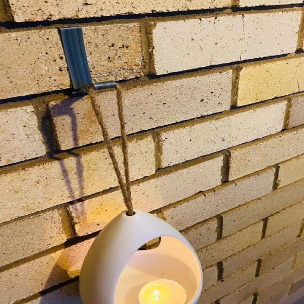 Brick hook with hanging candle holder