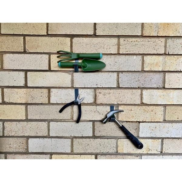 Home tools hanging on the brick hook